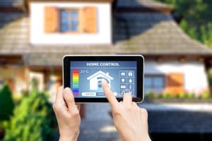 Person using tablet for smart home control