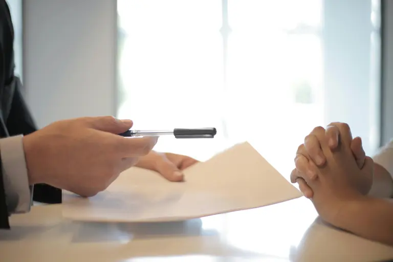 Business loan agreement documents on desk