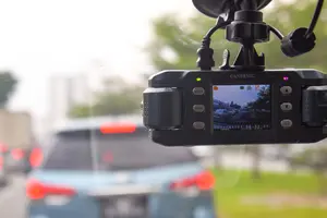 Dashboard camera recording traffic on city street