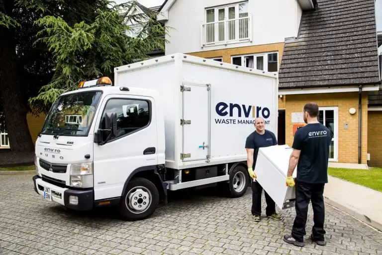 Enviro waste management team loading items into truck