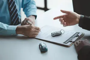 Signing car purchase contract agreement