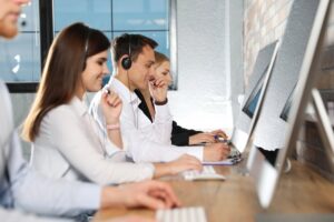 Support team taking calls in a modern office