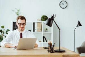 Businessman working on a laptop in a modern office