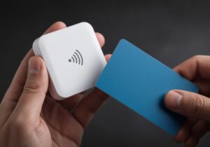 Contactless card being tapped on a small mobile card reader