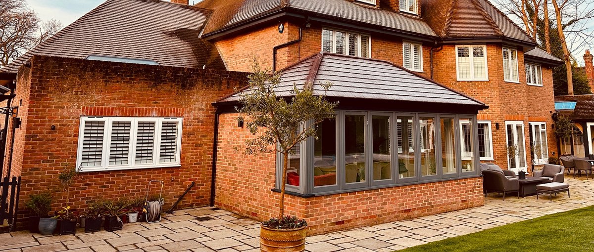 SupaLite tiled roof fitted to a brick conservatory with grey window frames