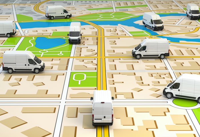 White vans on a city map, illustrating GPS vehicle tracking
